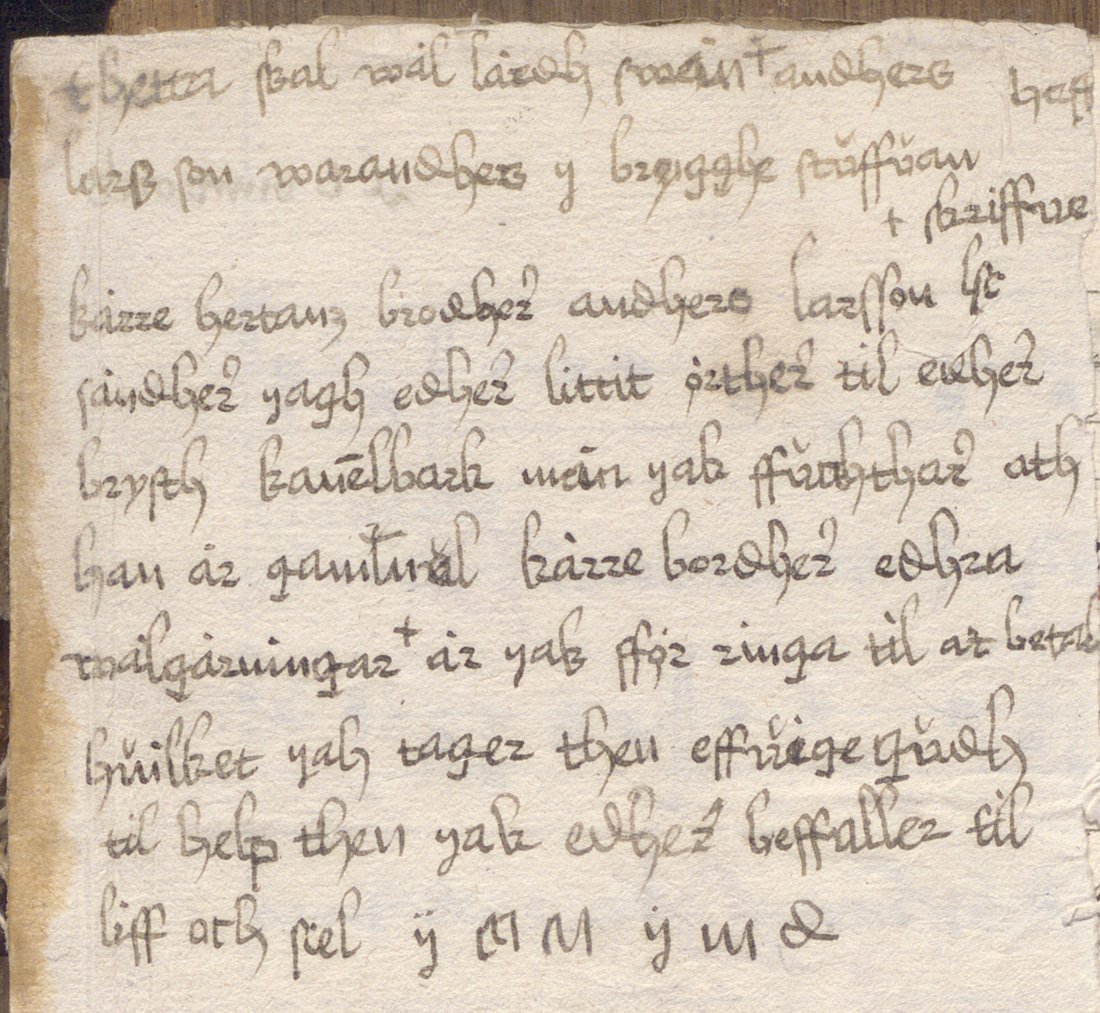 A paper slip with ten lines of Swedish cursive, pasted over the top of a page of chant